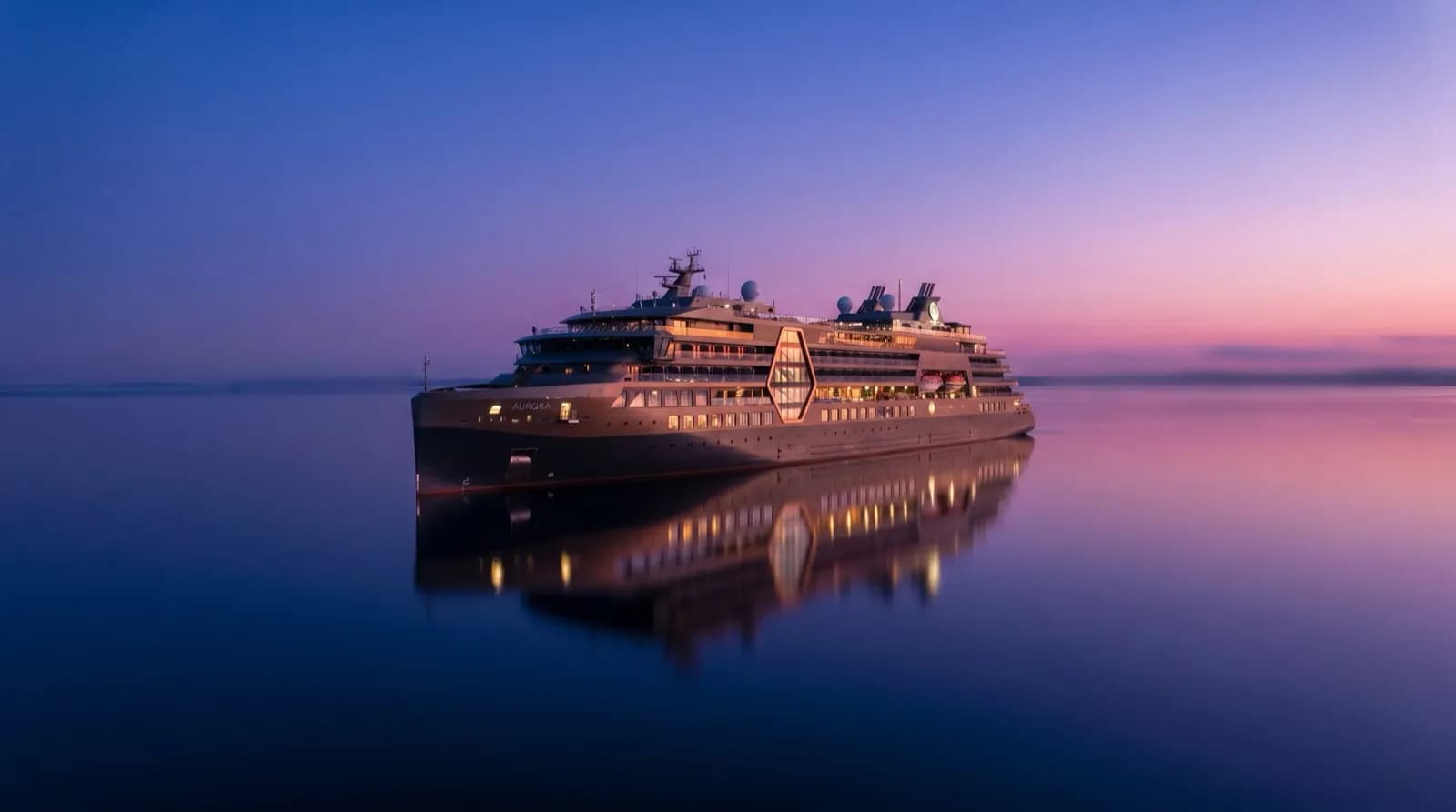 A sleek modern cruise ship at twilight on a calm sea